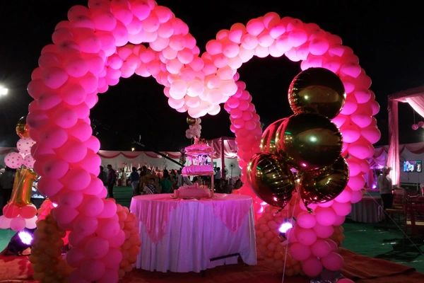 Themed birthday party decoration with colours, backdrop and lighting